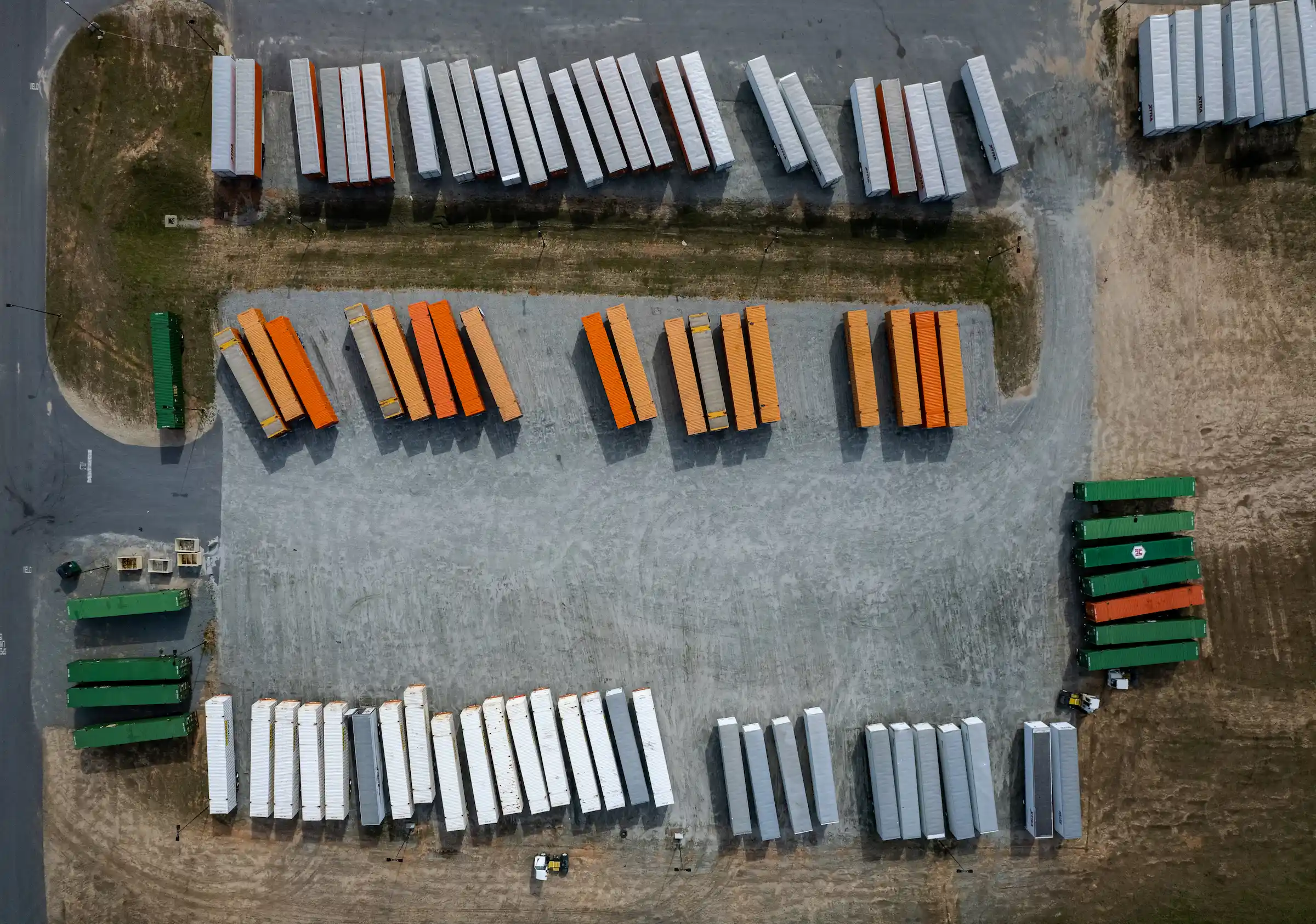 An aerial view of cargo containers in a storage yard.