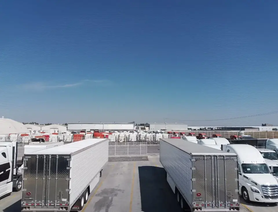 2 refrigerated trailers side-by-side comparing a Polyfrost coated roof versus an uncoated one, in Las Cruces, NM.