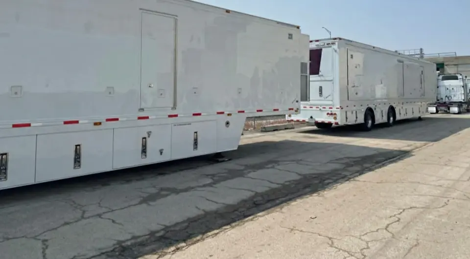 The side view of TV Broadcasting trailers which have been coated with PolyFrost.